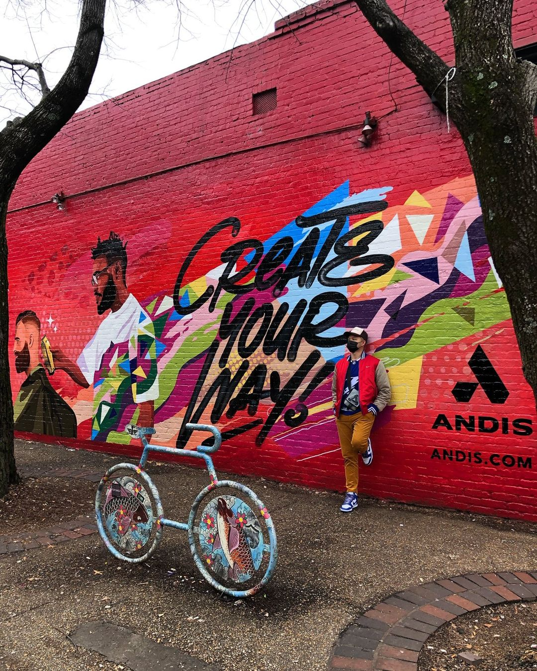 Brighter Community Atlanta man standing against wall mural