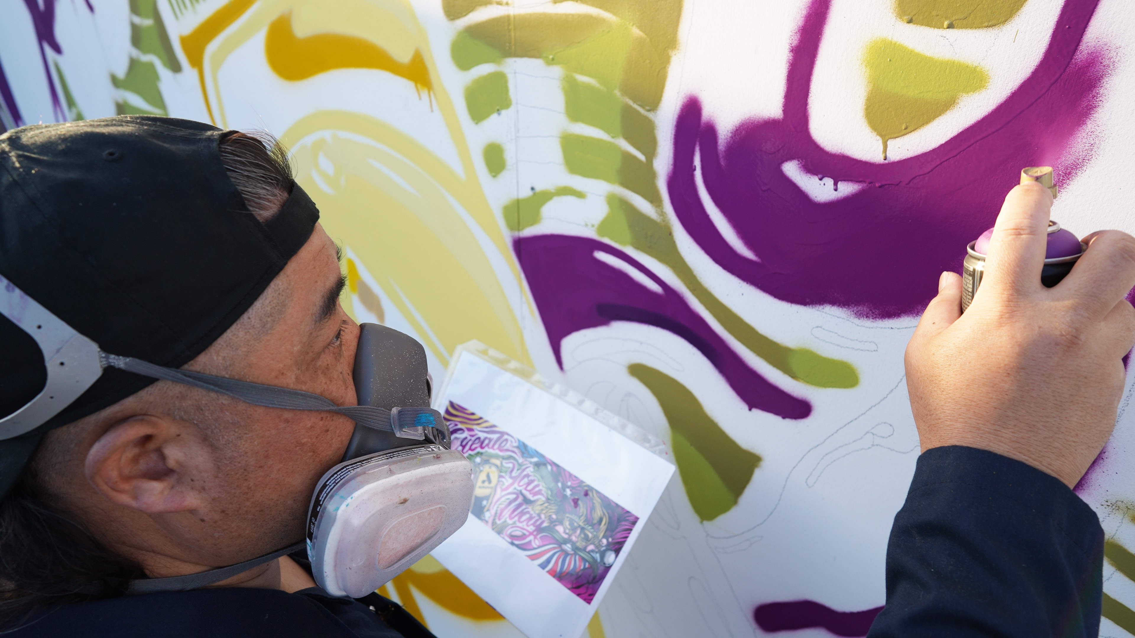 Brighter Community Venice Beach man spray painting on mural