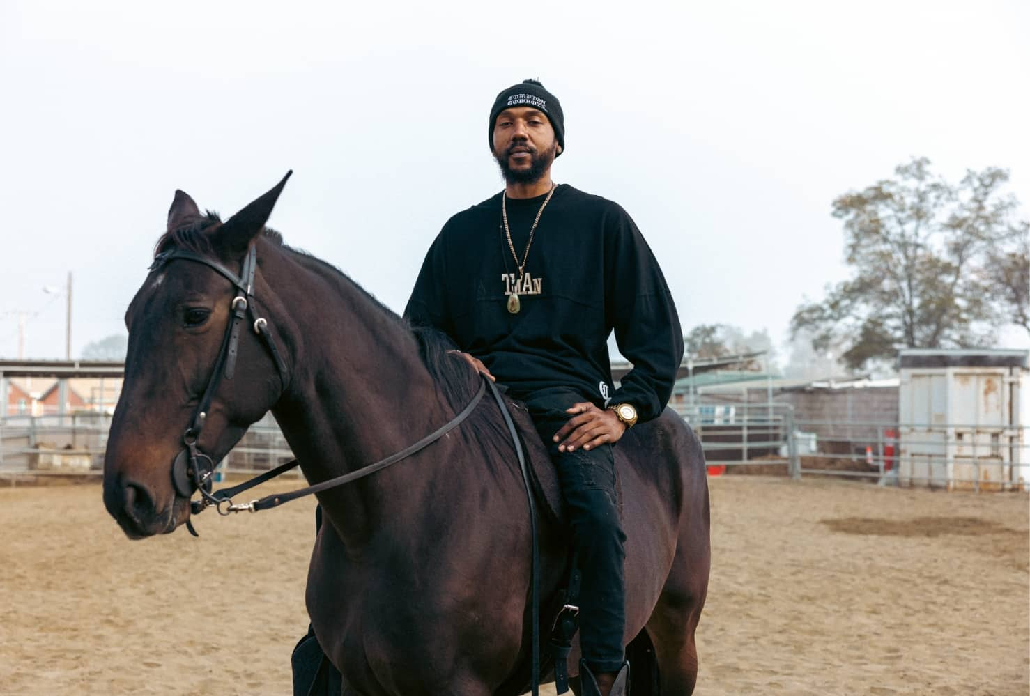 Compton Cowboys man riding brown horse