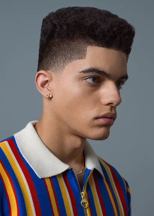 Male model shows of stylish 90s Retro Rise hairstyle.